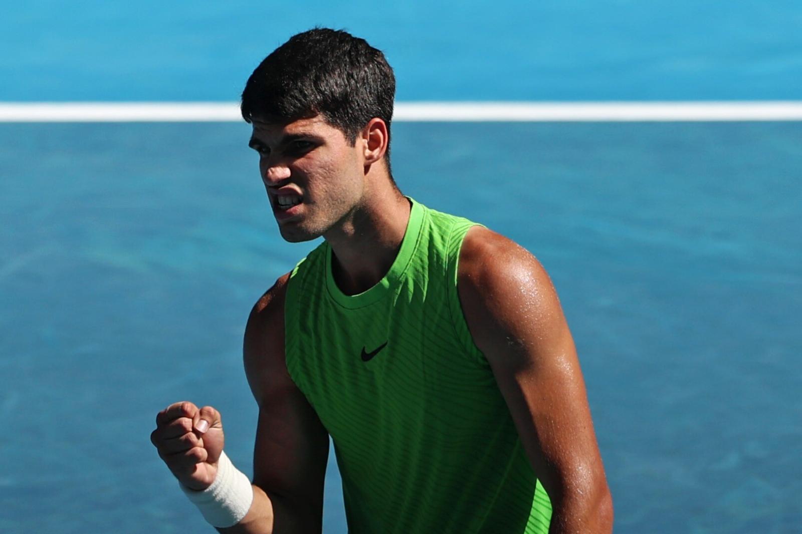 MELBOURNE, AUSTRALIA - JANUARY 30: Carlos Alcaraz of Spain celebrates a point in the Men's Singles Semifinal match against Alexander Zverev of Germany during day 13 of the 2026 Australian Open at Melbourne Park on January 30, 2026 in Melbourne, Australia. (Photo by Lintao Zhang/Getty Images)